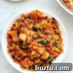 Kimchi Fried Rice with a fried egg in a white bowl.