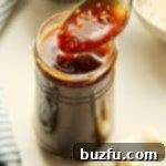 Homemade Teriyaki Sauce in a glass jar, ready for use.