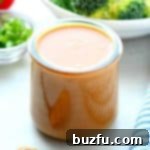 Smooth and creamy Peanut Dressing in a glass jar.