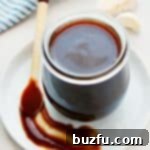 Homemade Hoisin Sauce stored in a glass jar.