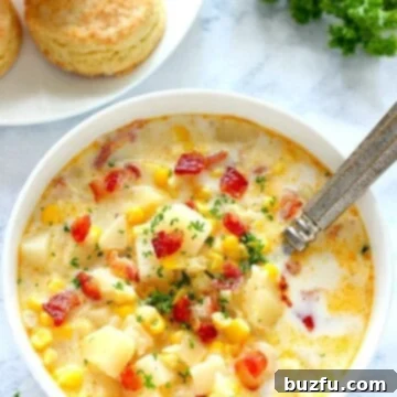 Instant Pot corn chowder in a bowl with spoon.