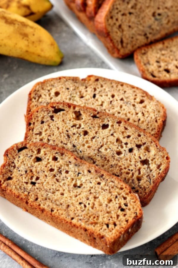 Cinnamon Sugar Banana Bread Sliced on Plate.