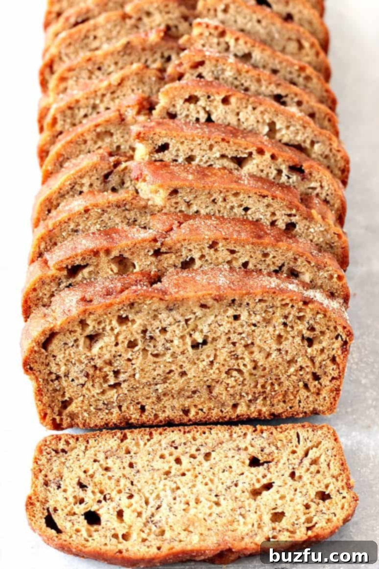 Overhead shot of whole banana bread sliced.