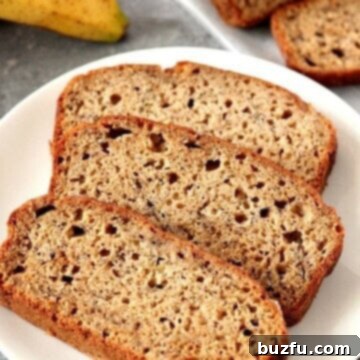 Cinnamon Sugar Banana Bread Sliced on Plate.