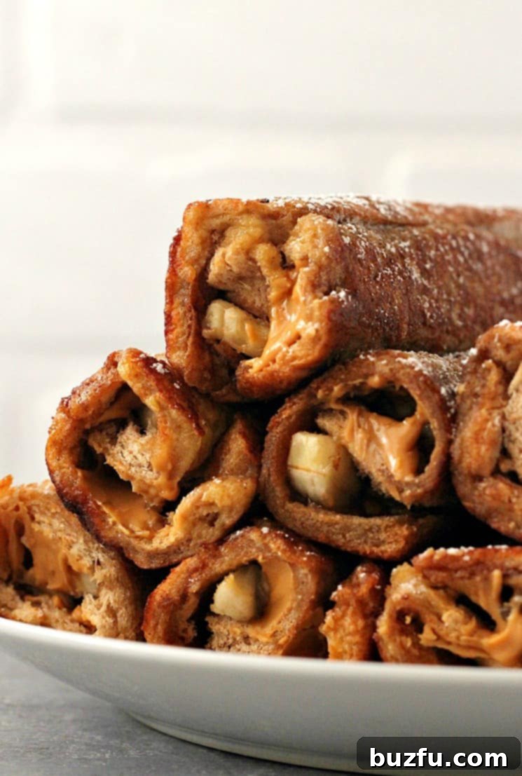 Close-up of Peanut Butter Banana French Toast Roll Ups, showcasing the golden crust and soft filling.