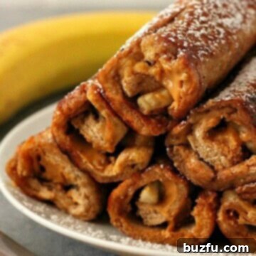 Peanut Butter Banana Roll Ups served on a plate, ready to eat.