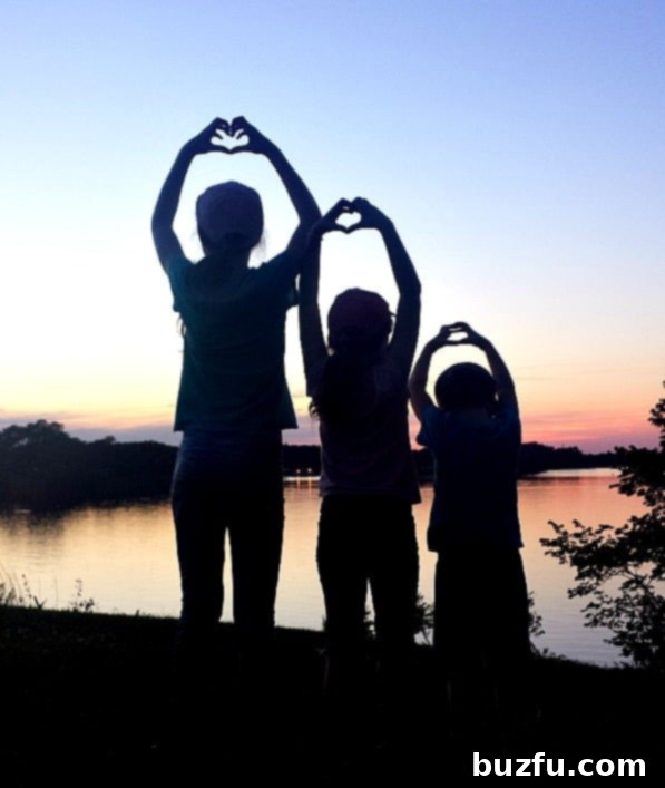 A serene lakeside view at sunset, with an RV parked nearby, capturing the peaceful moments of August 2017.
