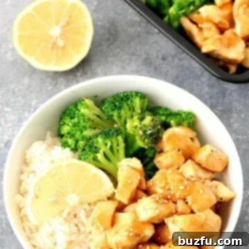 Honey Lemon Chicken in a bowl, glistening with its delicious sauce.