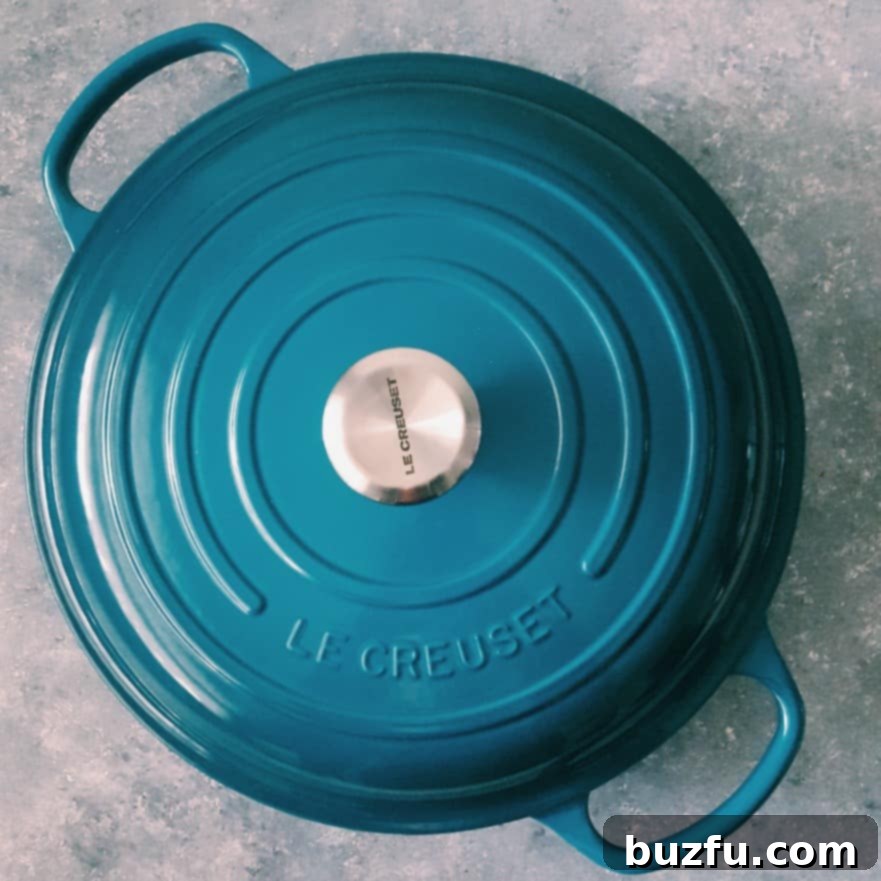 Le Creuset Braiser in beautiful teal color.