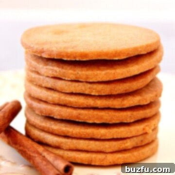 Stack of spiced shortbread cookies on a plate.