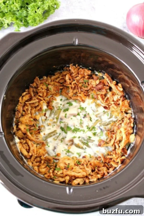 Slow Cooker Green Bean Casserole Recipe - save time and make the classic Thanksgiving side dish in your crock pot! No canned ingredients needed! Green Bean Casserole in a slow cooker.