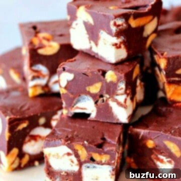 Decadent Rocky Road Fudge 3 Rocky Road Fudge in a white plate.