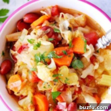 Instant Pot Vegetable soup in a bowl with spoon.