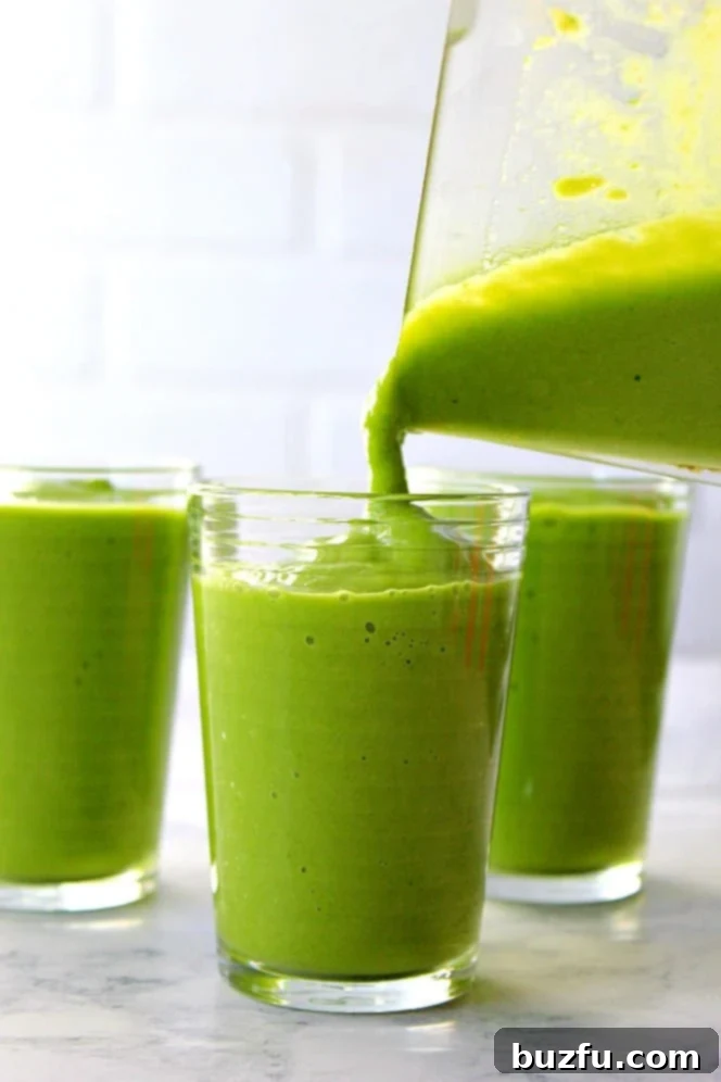 Pouring Avocado Glow Smoothie: A visual representation of the smoothie's inviting and healthy appearance. A stream of rich green avocado smoothie being poured into a tall glass, showcasing its thick, creamy texture.