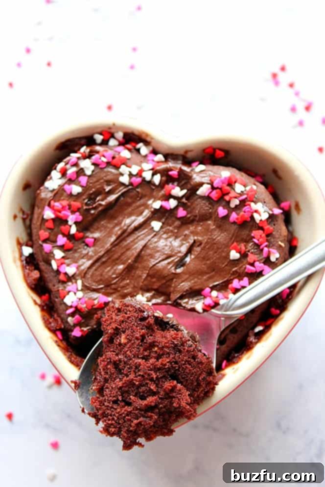 Perfectly cooked microwave chocolate mug cake, showcasing its fluffy texture and molten chocolate topping.