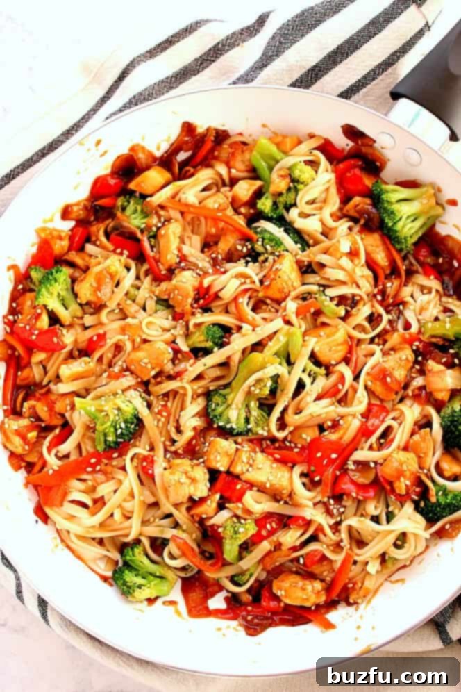 stir fry with noodles in skillet