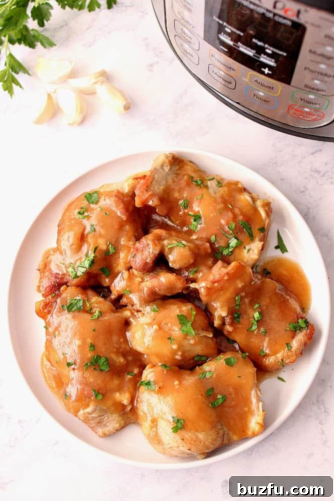 Plated Instant Pot Sweet Garlic Chicken, coated in a rich, glossy sauce, ready to be served.
