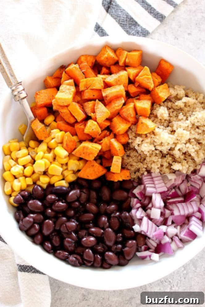 sweet potatoes, corn, black beans, red onion and quinoa in a bowl