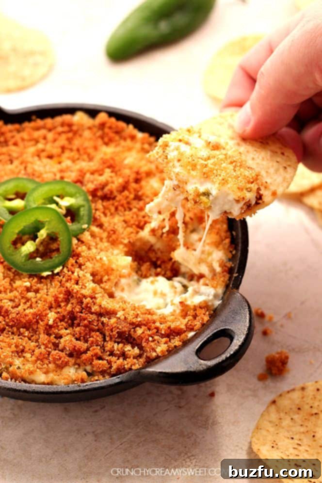 jalapeno popper dip in a cast iron skillet