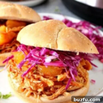 Instant Pot Hawaiian BBQ Chicken sandwiches on white plate with coleslaw.