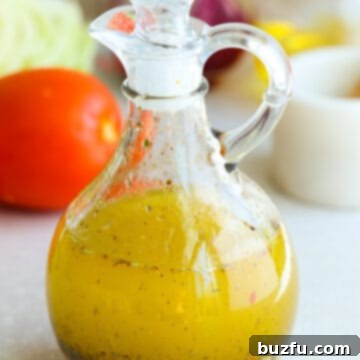 Zesty Italian Dressing 6 Italian salad dressing in a glass cruet on a gray board.