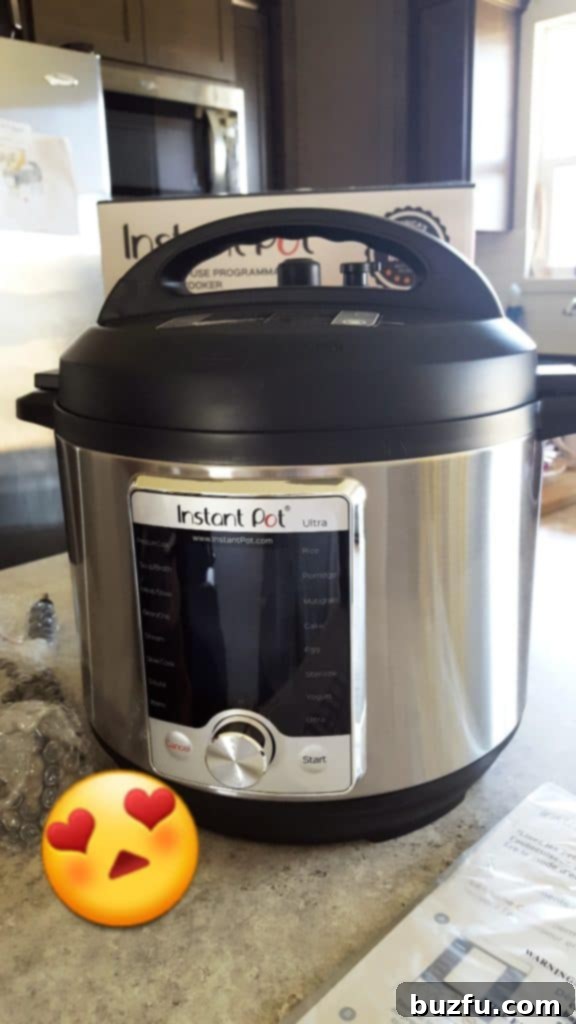 A pristine Instant Pot Ultra, still in its original packaging, gleaming on a modern kitchen counter, ready for its inaugural use.