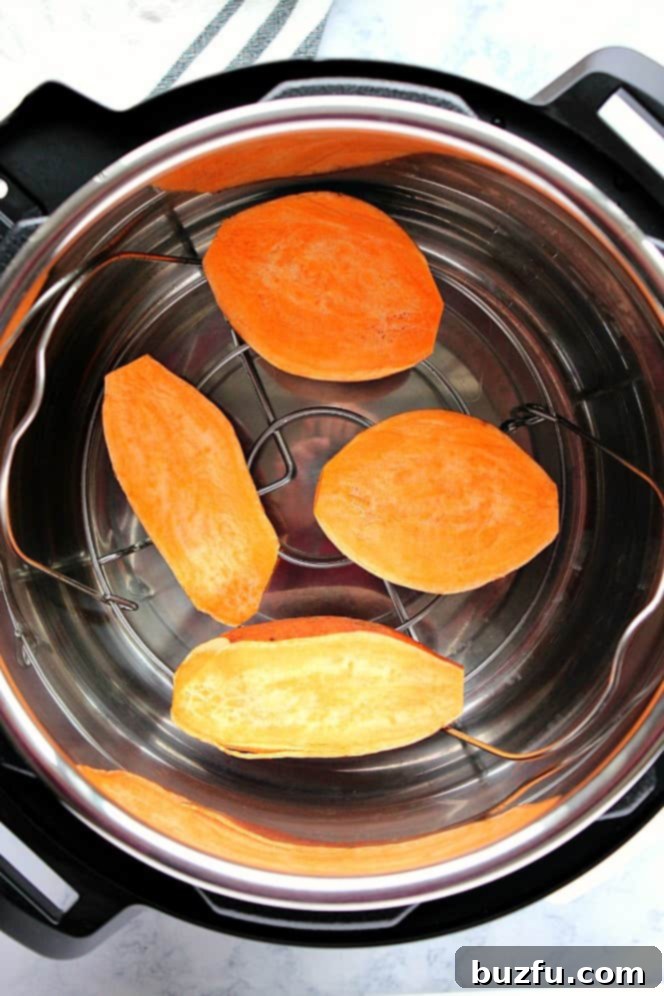 Effortless Instant Pot Sweet Potatoes 5 Overhead shot of sweet potato halves on trivet in Instant Pot.