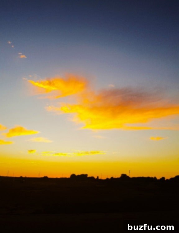 A breathtaking sunset paints the sky with warm hues of orange and purple, reflecting gratitude and peace.