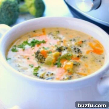Velvety Instant Pot Broccoli Cheddar Delight 2 Instant Pot broccoli cheddar soup in white bowl with handles.