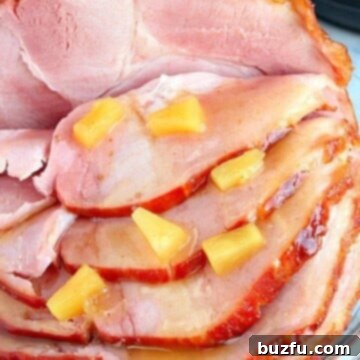 Ham slices on a platter with pineapple glaze.