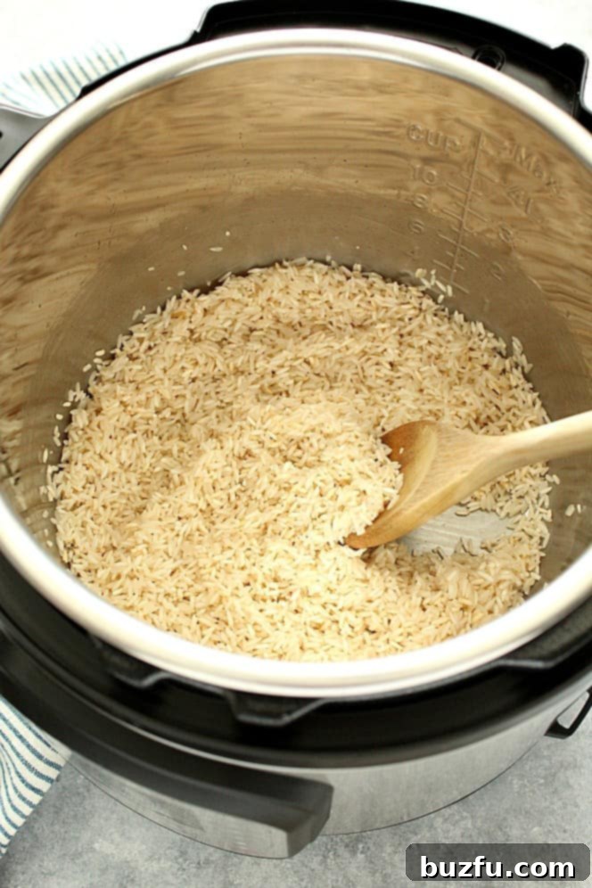 How to make the best fluffy rice in the Instant Pot. Overhead shot of long grain white rice in the Instant Pot.