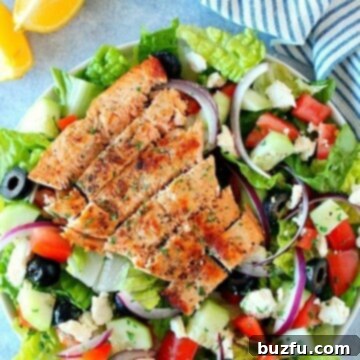 Salmon salad in large white bowl, a full meal shot.
