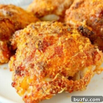 Air-Fried Crispy Chicken Perfection 3 Air Fryer Fried Chicken thigh on white plate.