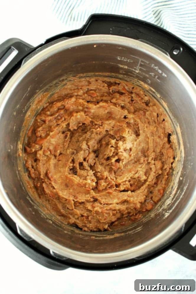 Overhead shot of mashed refried beans in the Instant Pot.