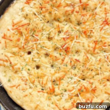 Speedy Skillet Focaccia 2 Skillet Focaccia with Parmesan cheese on top.