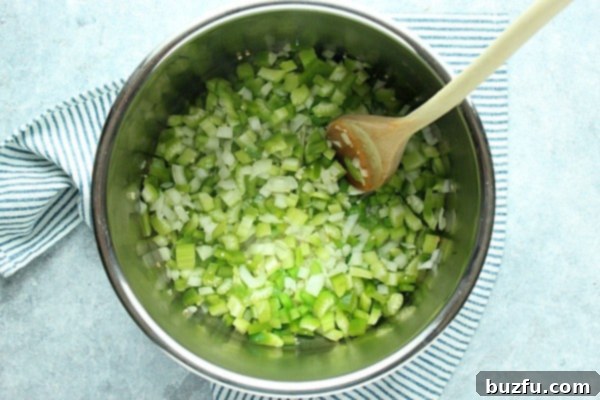 Chopped bell peppers and onions sautéing in the Instant Pot.