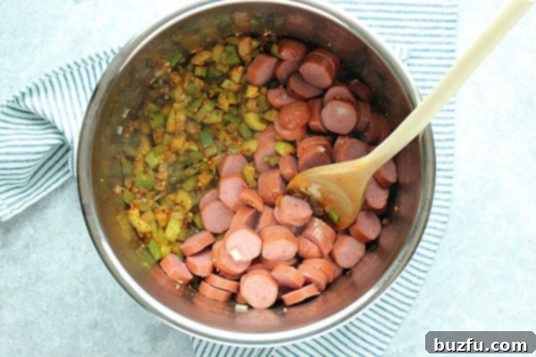 Sautéed bell peppers and sliced sausage in the Instant Pot.