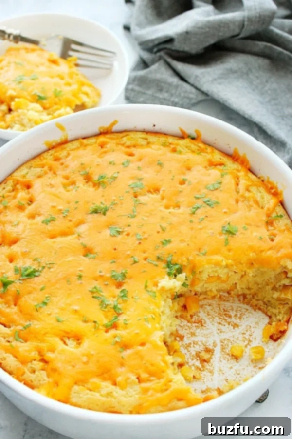 Easy Corn Pudding made with sweet corn and cornbread mix from scratch. Corn Pudding with cheesy topping in baking dish.