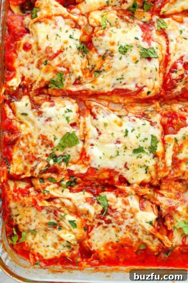 Delicious Vegetarian Eggplant Lasagna, a low-carb alternative for dinner. Eggplant Lasagna in a glass baking dish, freshly baked and ready to serve.