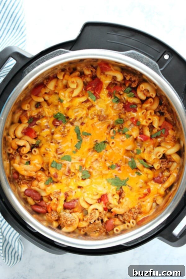 Rich and creamy Instant Pot Chili Mac and Cheese in the pressure cooker, ready to serve.