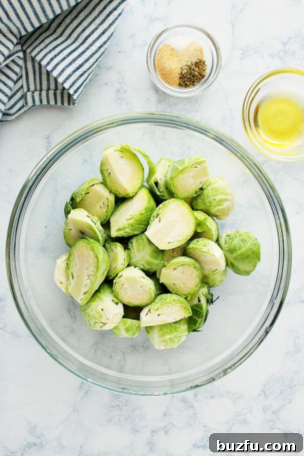 Air Fryer Brussels Sprouts ingredients on a marble board.