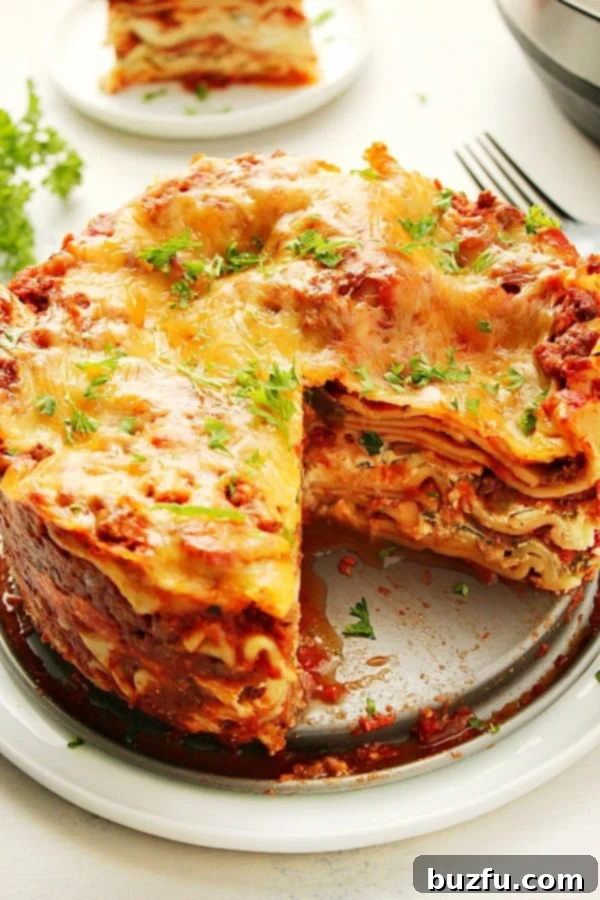 Instant Pot Lasagna in a springform pan on a plate.