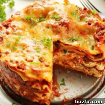 Instant Pot Lasagna in a springform pan on a plate.