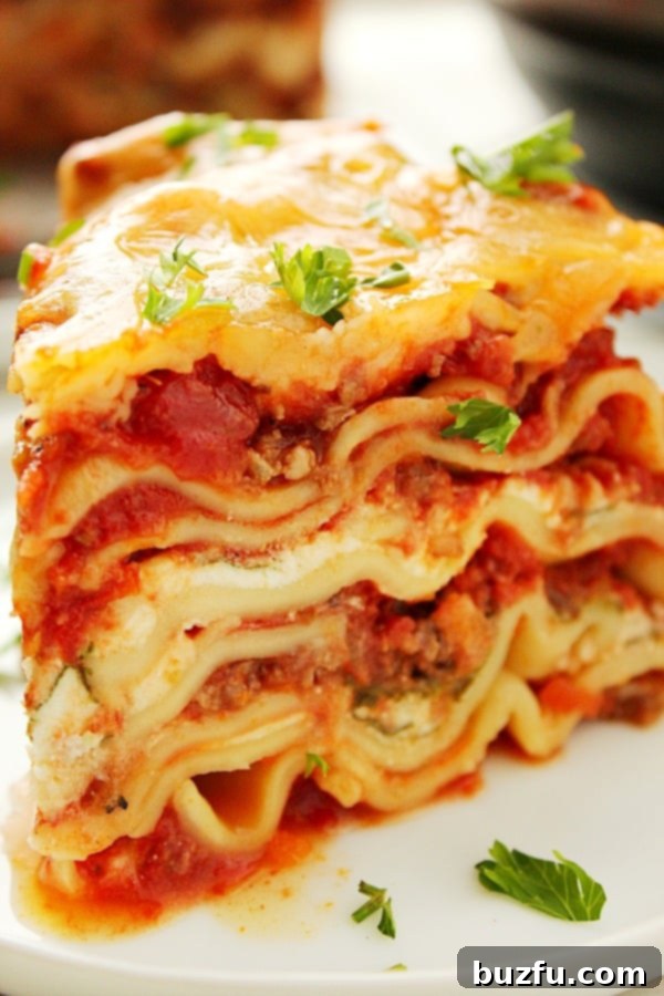 A slice of Instant Pot Lasagna on a white plate.