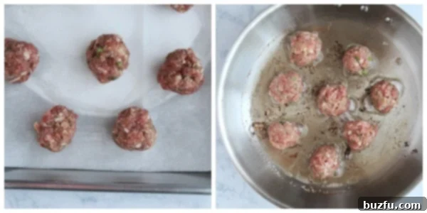 Meatballs are shaped and ready for baking or frying to perfection. Carefully forming tablespoon-sized Greek meatballs by hand, ensuring uniform size and shape before cooking.