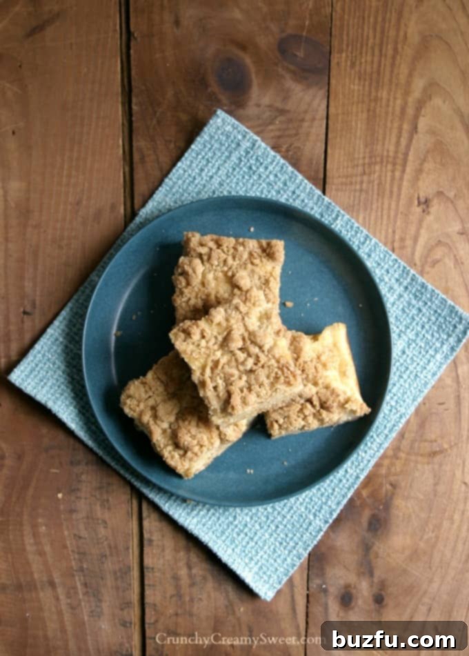 A cutting board filled with freshly baked Sour Cream Crumb Bars, ready to be served.
