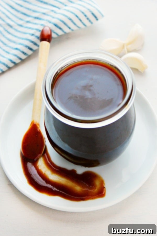 Freshly made Homemade Hoisin Sauce in a clear glass jar, ready to be used in Asian dishes.