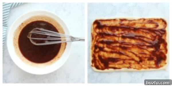 Make and spread the cinnamon roll filling. Cinnamon-sugar filling being spread evenly over rolled-out dough.