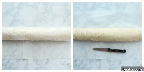 Make marks with knife in the rolled dough for even cutting. Rolled cinnamon roll dough with knife marks indicating where to cut.