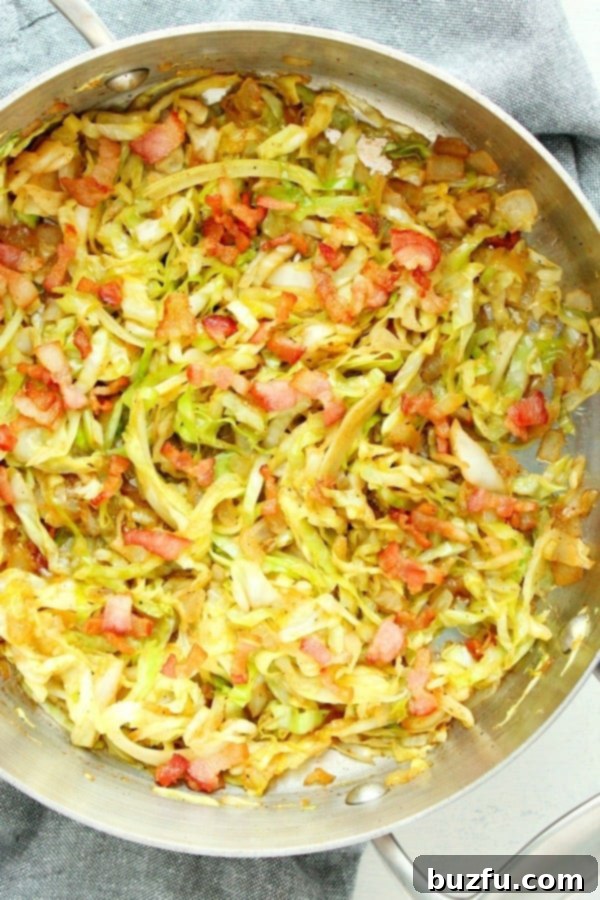 Crispy Fried Cabbage with bacon in a large skillet, ready to be served.